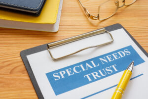 special needs trust application with clipboard and notepad
